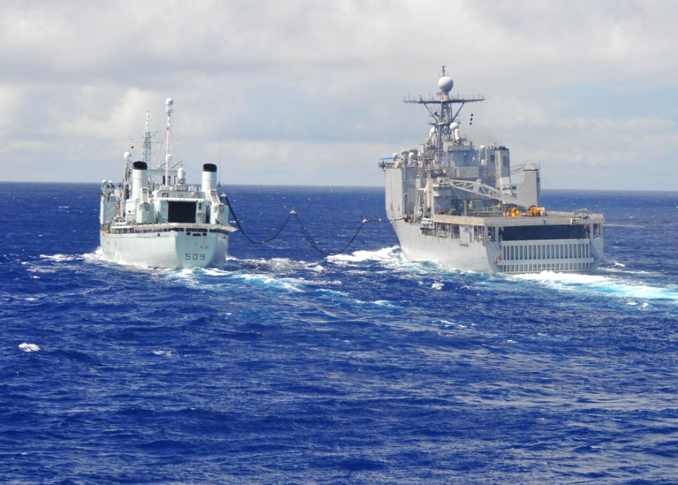 US Navy 110227-N-ZS026-007 The Canadian navy auxiliary oiler replenishment HMCS Protecteur (AOR 509) refuels the amphibious dock landing ship USS C