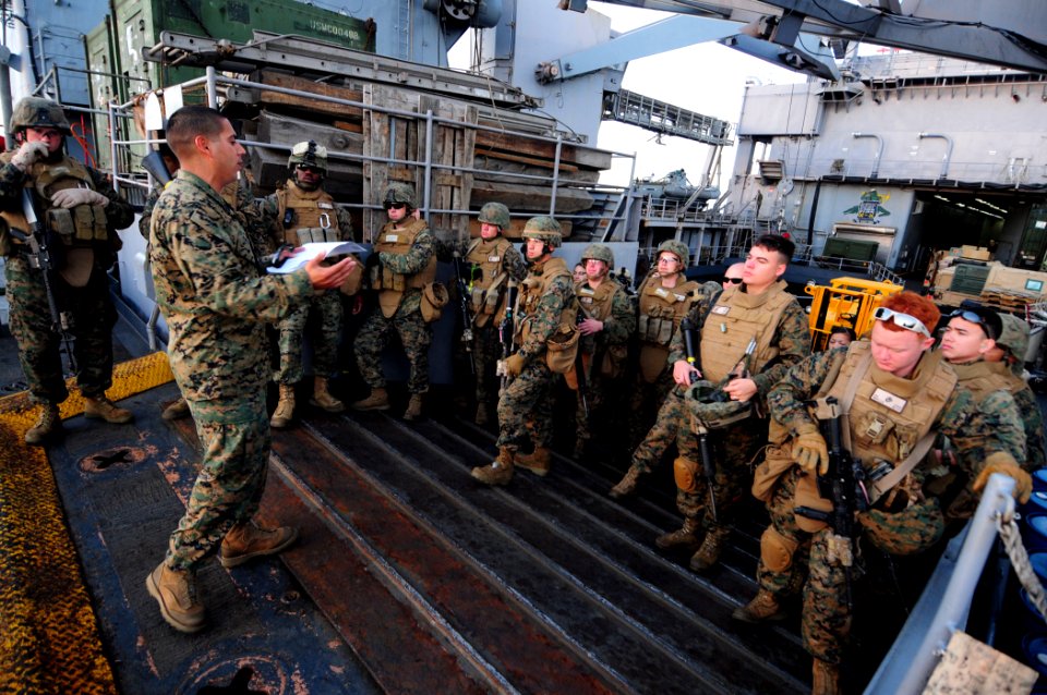 US Navy 110305-N-RC734-015 Gunnery Sgt. Rafael Ortega briefs Marines on safety procedures before a small-arms live-fire exercise aboard USS Comstoc