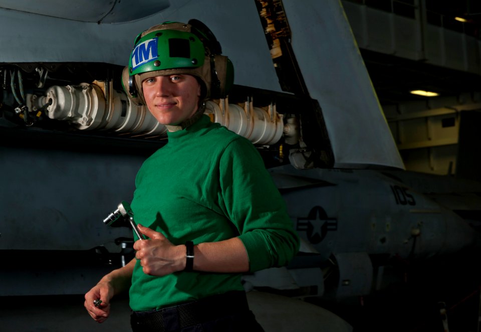 US Navy 110307-N-DR144-117 Aviation Structural Mechanic 3rd Class Jessica Murphy pauses while removing the outer wing of an F-A-18F Super Hornet fo