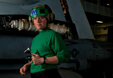 US Navy 110307-N-DR144-117 Aviation Structural Mechanic 3rd Class Jessica Murphy pauses while removing the outer wing of an F-A-18F Super Hornet fo