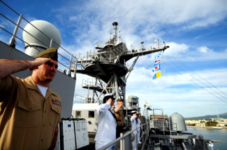 US Navy 110301-N-RC734-055 Sailors and Marines aboard the amphibious dock landing ship USS Comstock (LSD 45) render honors as the ship passes the U
