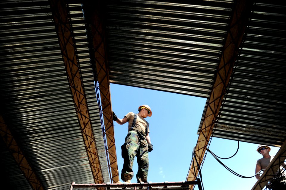 US Navy 110308-N-EC642-113 Seabees repair a classroom roof at Escuela Rural Lempira during a weeklong Southern Partnership Station 2011 subject mat
