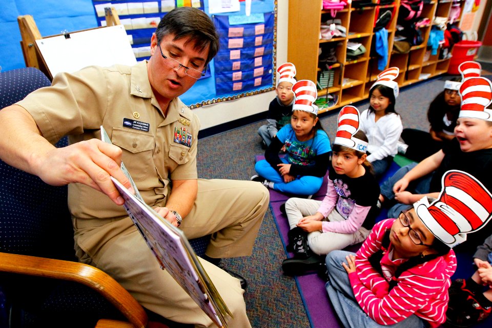 US Navy 110302-N-HW977-194 Capt. Jay Kadowaki reads to students at Clara Barton Elementary School during a Read Across America event
