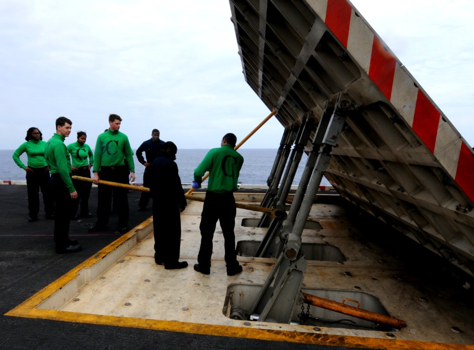 US Navy 110303-N-NB544-131 Sailors practice emergency lowering of a jet blast deflector before graded training aboard the aircraft carrier USS Rona