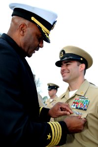US Navy 110303-N-5328N-972 Senior Chief Sonar Technician (Surface) Matt Lewis, right, receives the Navy's newly-created enlisted information domina