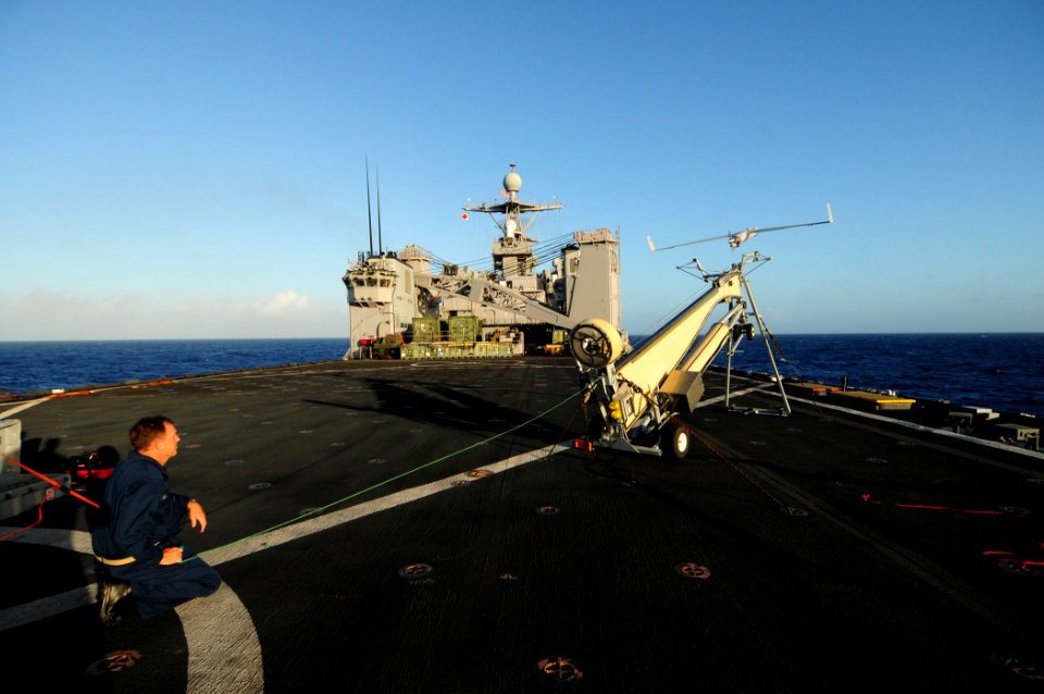 US Navy 110309-N-RC734-004 Chief Warrant Officer Brian Archer, assigned to Assault Craft Unit (ACU) 1, launches a Scan Eagle unmanned aerial vehic