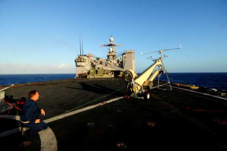US Navy 110309-N-RC734-004 Chief Warrant Officer Brian Archer, assigned to Assault Craft Unit (ACU) 1, launches a Scan Eagle unmanned aerial vehic