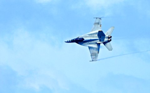 US Navy 110309-N-DX615-045 An F-A-18F Super Hornet assigned to the Bounty Hunters of Strike Fighter Squadron (VFA) 2 flies past the aircraft carrie
