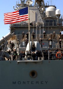 US Navy 110307-N-5292M-034 Sailors man the rails as the guided-missile cruiser USS Monterey (CG 61) prepares to depart Naval Station Norfolk for a