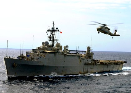 US Navy 110310-N-3154P-087 An MH-60S Sea Hawk helicopter assigned to Helicopter Sea Combat Squadron (HSC) 22 flies above the amphibious transport d
