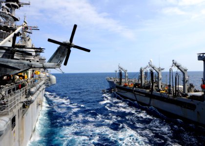 US Navy 110310-N-3154P-055 The Military Sealift Command fleet replenishment oiler USNS Kanawha (T-AO 196), right, extends fuel lines to the amphibi
