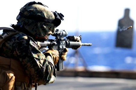 US Navy 110305-N-RC734-314 Cpl. Rosa Luna, assigned to Combat Logistics Battalion (CLB) 13, participates in a small arms live-fire exercise aboard