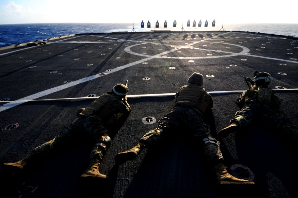 US Navy 110305-N-RC734-085 Marines discharge their weapons from the prone firing position during a small-arms live-fire exercise aboard USS Comstoc