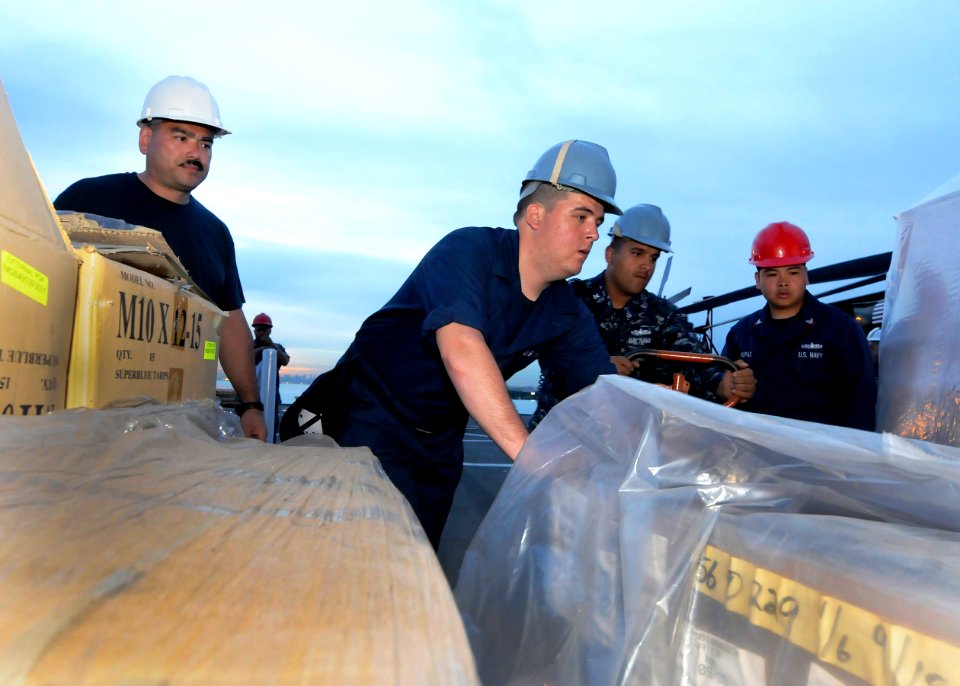 US Navy 110311-N-5716H-290 Sailors load humanitarian assistance supplies aboard the U.S. 7th Fleet command ship USS Blue Ridge (LCC 19) in Singapor