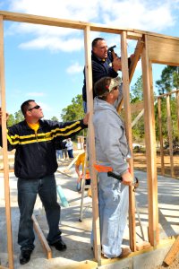 US Navy 110311-N-DD445-003 Sailors assigned to the guided-missile frigate USS Klakring (FFG 42), construct frames for a Habitat for Humanity home a