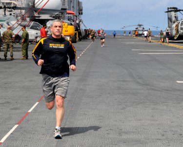 US Navy 110306-N-4743B-086 Sailors and Marines participate in a fun run on the flight deck of USS Essex (LHD 2)