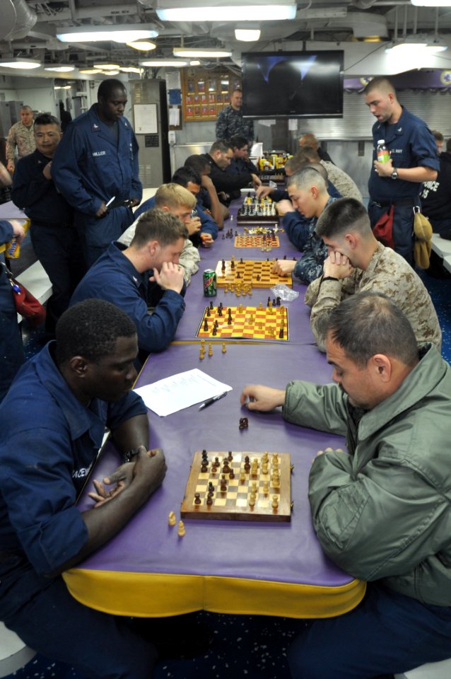 US Navy 110311-N-7293M-186 Sailors and Marines aboard the amphibious transport dock ship USS Ponce (LPD 15) compete in a chess tournament sponsored