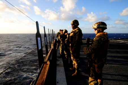 US Navy 110305-N-RC734-100 Marines inspect their targets during a small-arms live-fire exercise aboard USS Comstock (LSD 45)