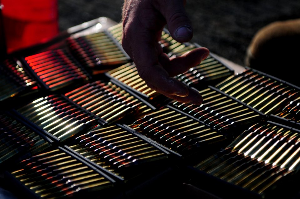 US Navy 110305-N-RC734-172 Sgt. Michael Croft counts and organizes ammunition during a small-arms live-fire exercise aboard USS Comstock (LSD 45)