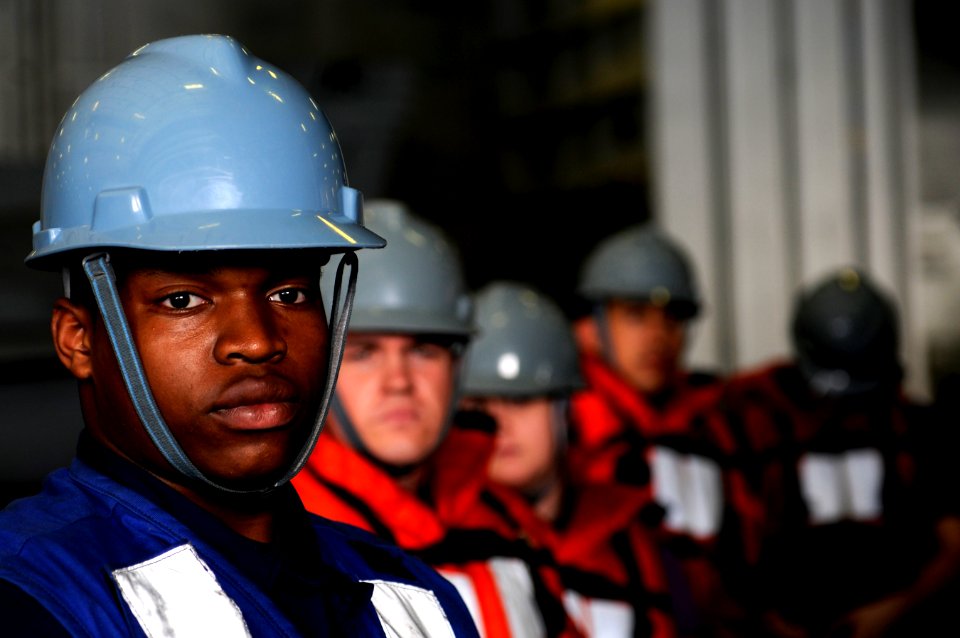 US Navy 110309-N-8040H-528 Seaman Jerrell Merren, assigned to the deck department aboard the Nimitz-class aircraft carrier USS Carl Vinson (CVN 70)