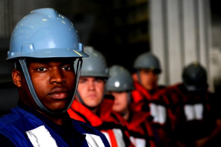 US Navy 110309-N-8040H-528 Seaman Jerrell Merren, assigned to the deck department aboard the Nimitz-class aircraft carrier USS Carl Vinson (CVN 70)