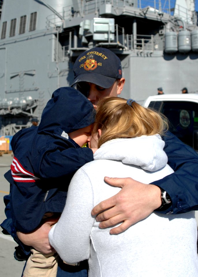 US Navy 110307-N-5292M-065 Cryptologic Technician (Technical) 3rd Class Will Payne hugs his family before boarding the guided-missile cruiser USS M