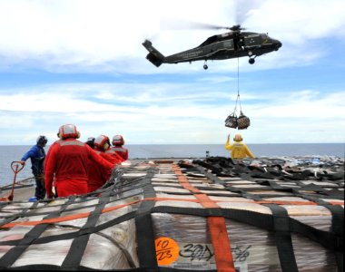 US Navy 110312-N-0864H-211 Sailors aboard the U.S. 7th Fleet command ship USS Blue Ridge (LCC 19) stand-by to move pallets of humanitarian relief s