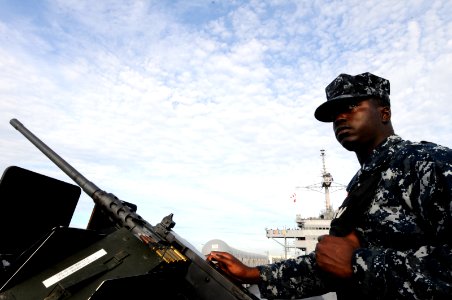 US Navy 110312-N-5716H-282 Yeoman 3rd Class Andrew Spears stands watch during sea and anchor detail as the U.S. 7th Fleet command ship USS Blue Rid