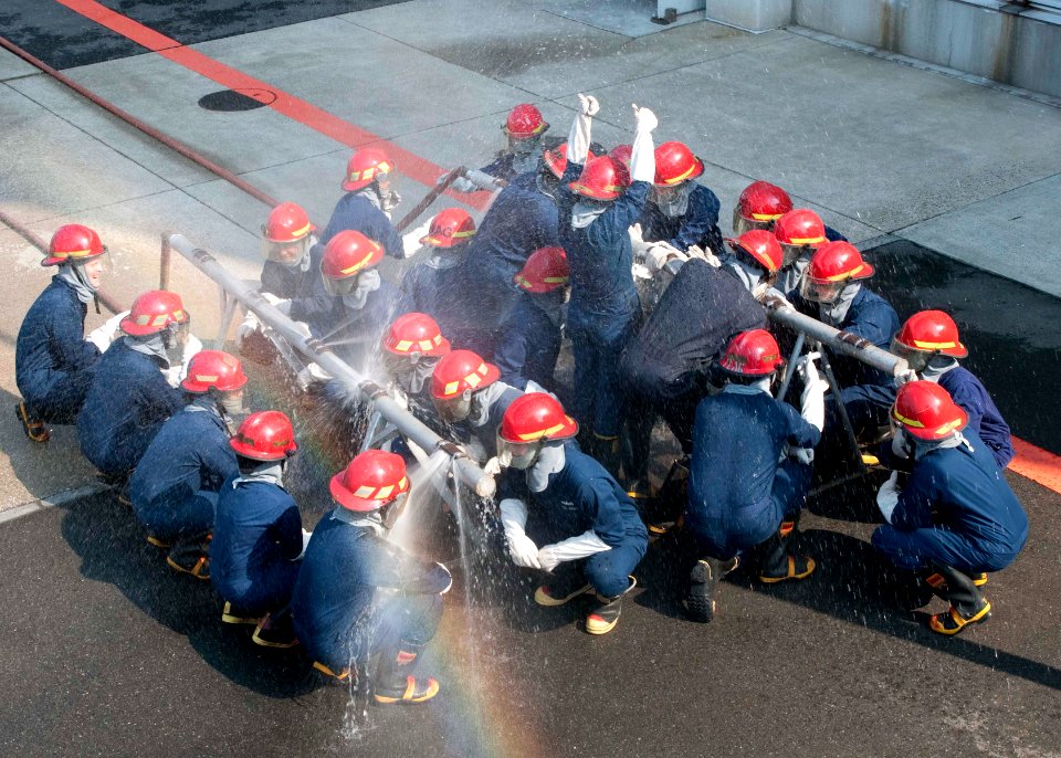 US Navy 110308-N-EA192-034 Sailors stand by as their banding patches are tested for watertight integrity at the Yokosuka Center for Naval Engineeri