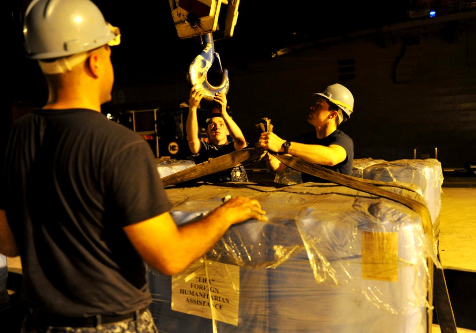 US Navy 110311-N-0864H-821 USS Blue Ridge (LCC 19) on-load humanitarian assistance supplies in Singapore to ensure the ship and crew are ready to s