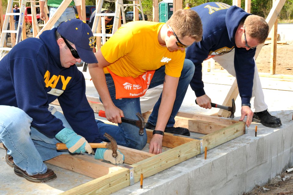 US Navy 110311-N-DD445-001 Chief Gas Turbine System Technician Jon Gross, left, Hull Maintenance Technician 3rd Class Travis Werfelman and Electron