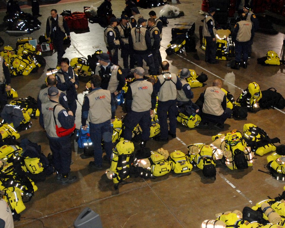 US Navy 110314-N-ZI955-028 Virginia Task Force 1 from the Fairfax County Fire and Rescue Department performs last-minute equipment checks before de