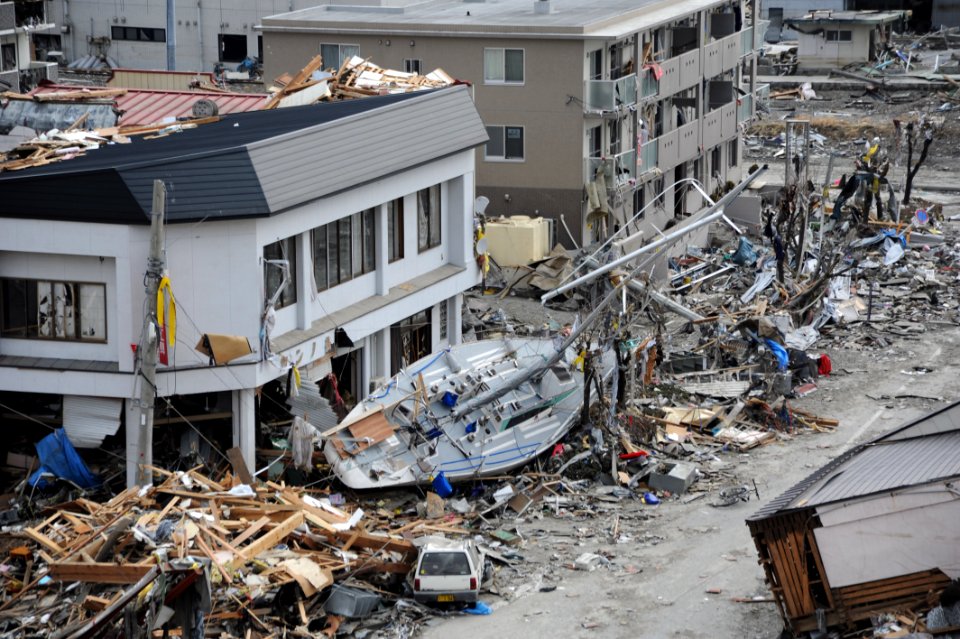 US Navy 110315-N-2653B-118 A fishing boat is among debris in Ofunato, Japan, following a 9.0 magnitude earthquake and subsequent tsunami