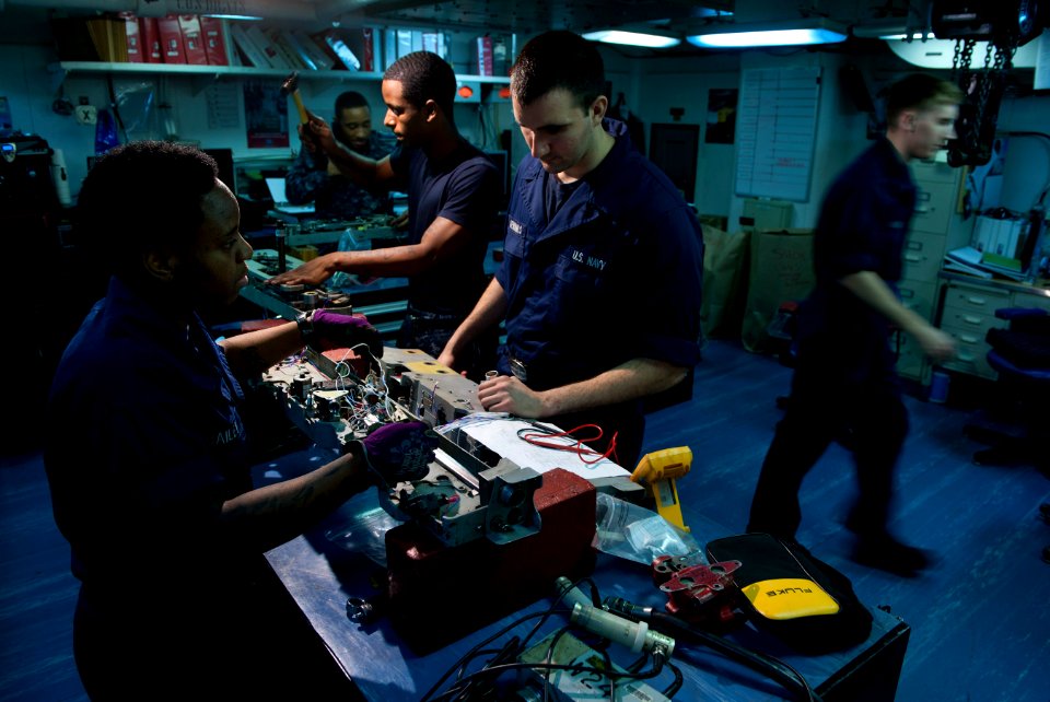 US Navy 110310-N-DR144-395 Aviation Ordnanceman Airman Barbara Bailey and Aviation Ordnanceman Airman Thomas Jennings perform a 210-day inspection