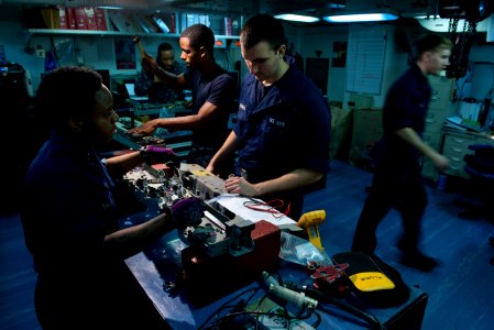 US Navy 110310-N-DR144-395 Aviation Ordnanceman Airman Barbara Bailey and Aviation Ordnanceman Airman Thomas Jennings perform a 210-day inspection