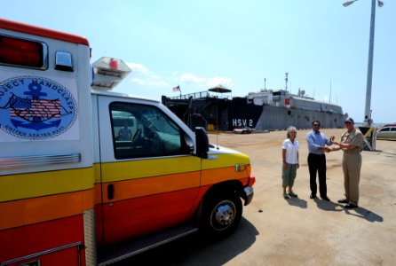 US Navy 110310-N-WX845-004 Cmdr. Mark Becker, right, mission commander of Southern Partnership Station 2011, passes the keys for an ambulance to Jo photo