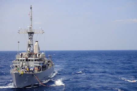 US Navy 110311-N-5185B-001 The mine countermeasures ship USS Guardian (MCM 5) conducts an underway replenishment with the Military Sealift Command
