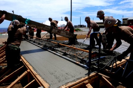 US Navy 110315-N-1825E-252 Seabees assigned to Naval Mobile Construction Battalion (NMCB) 28 lay concrete during the construction of a recreation c photo