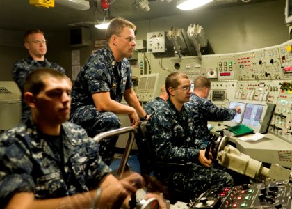 US Navy 110315-N-FG395-006 Senior Chief Missile Technician Wyatt Harris, center, Blue Team assistant navigator aboard the ballistic-missile submari
