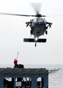 US Navy 110315-N-5538K-188 An MH-60S Sea Hawk helicopter transports humanitarian assistance supplies