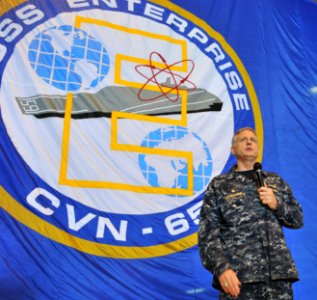 US Navy 110314-N-0569K-171 Capt. Dee L. Mewbourne speaks to the crew in the hangar bay aboard USS Enterprise (CVN 65)