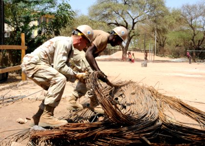 US Navy 110311-N-SN160-130 Seabees sort a load of rebar during the construction of a school