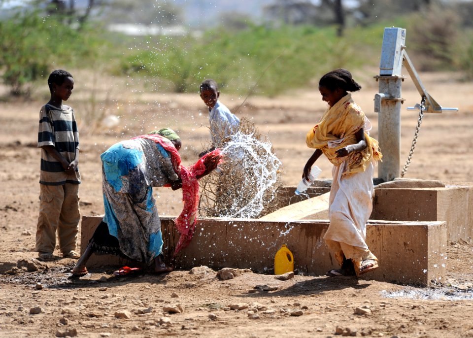 US Navy 110311-N-SN160-227 Ethiopian children play in the water of a well built by Seabees assigned to Naval Mobile Construction Battalion (NMCB) 7