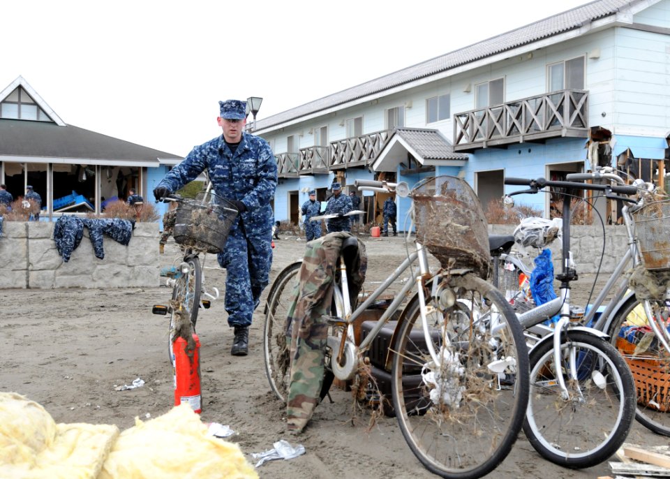 US Navy 110315-N-MU720-027 Yeoman 2nd Class Jordan Smith, from Owosso, Mich., assigned to Naval Air Facility Misawa, salvages a bicycle at the Misa