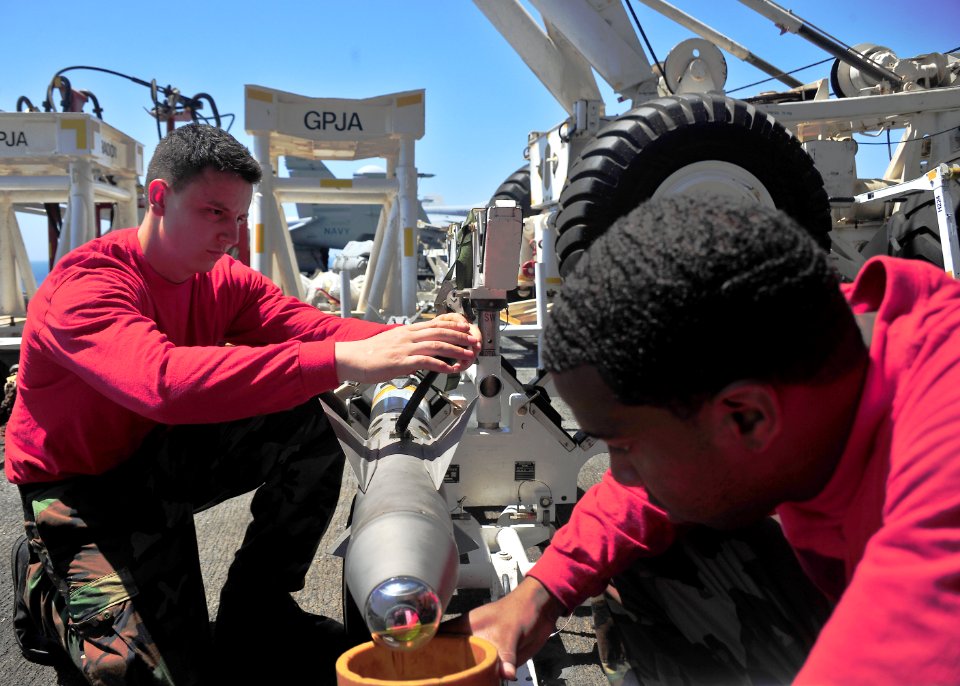 US Navy 110317-N-0074G-003 Aviation Ordnanceman Airman Luke Legaspi, left, and Aviation Ordnanceman Airman Michael Williams conduct a routine safet
