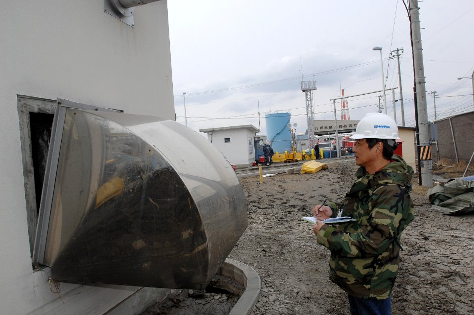US Navy 110315-N-ZI955-093 Ariel Genido assesses the damage to Fleet and Industrial Supply Center Yokosuka Defense Fuel Support Point Hachinohe