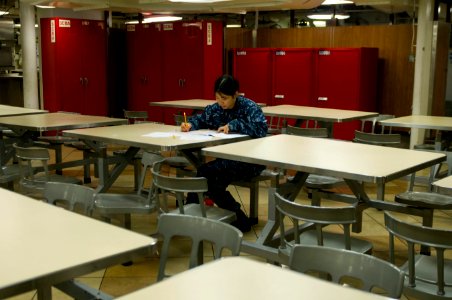 US Navy 110317-N-7488A-019 Personnel Specialist Seaman Jianpeng Huang, assigned to the administrative department, takes the E-4 advancement exam