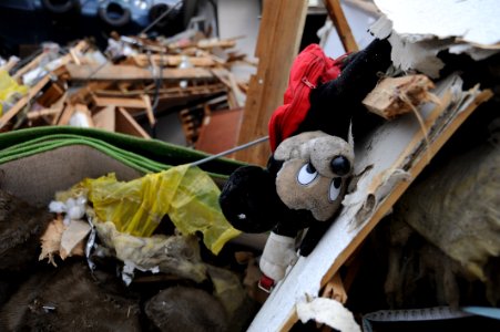 US Navy 110315-N-2653B-153 A Mickey Mouse doll lies among debris in Ofunato following a 9.0 magnitude earthquake and subsequent tsunami