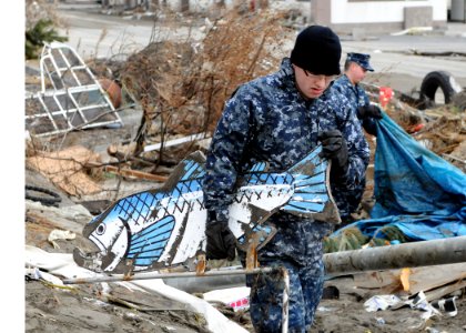US Navy 110315-N-MU720-062 Mineman Seaman Jerad Clymer, from Houston, assigned to Naval Air Facility Misawa, removes debris from a park at the Misa