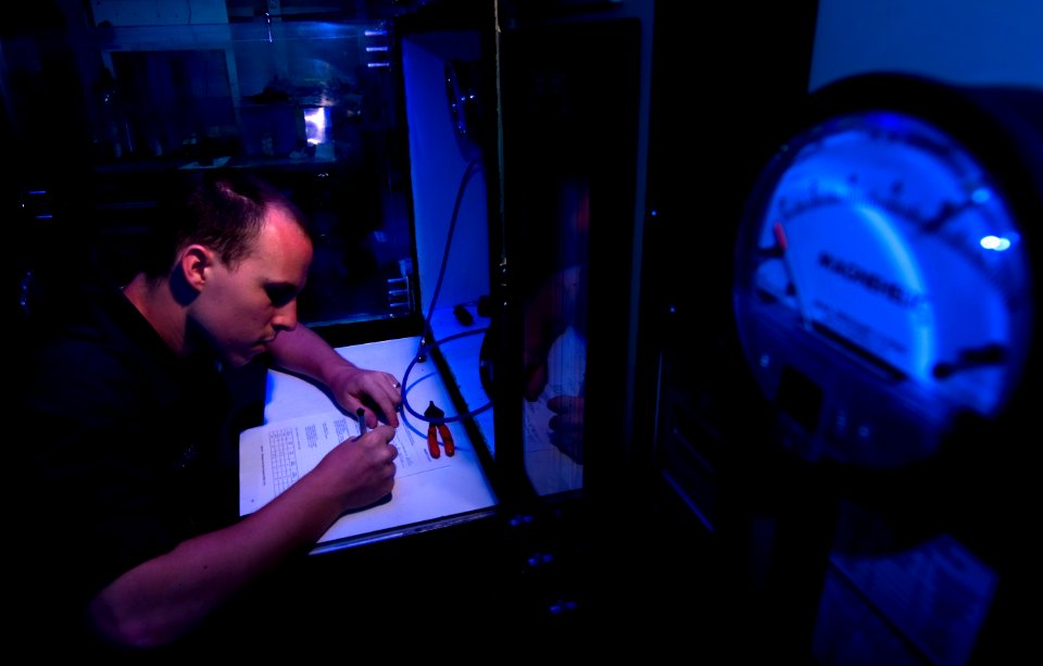 US Navy 110315-N-6320L-084 Aircrew Survival Equipmentman Airman Corey Morris, assigned to the IM-2 division of the Aviation Intermediate Maintenanc